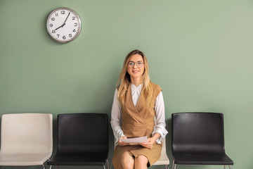 Young woman waiting for job interview indoors