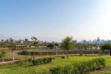Fototapeta na wymiar Taichung Central Park at the Shuinan Economic and Trade Area in blue sky sunny day. Former Shuinan Airport, lot of green space in here, the second largest park in Taiwan. Xitun District, Taichung City
