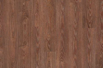 Naklejka premium Natural dark brown wooden surface floor texture background. polished laminate parquet