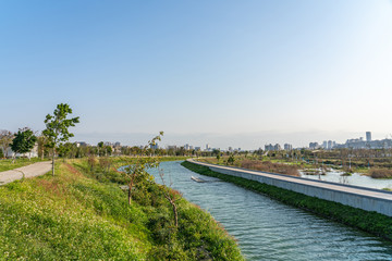 Fototapeta premium Taichung Central Park at the Shuinan Economic and Trade Area in blue sky sunny day. Former Shuinan Airport, lot of green space in here, the second largest park in Taiwan. Xitun District, Taichung City