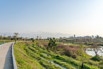 Taichung Central Park at the Shuinan Economic and Trade Area in blue sky sunny day. Former Shuinan Airport, lot of green space in here, the second largest park in Taiwan. Xitun District, Taichung City
