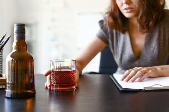 Young Drunk Woman In Office. Concept Of Alcoholism