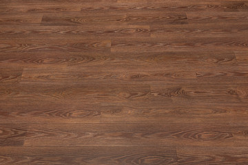 Obraz na płótnie Canvas Natural dark brown wooden surface floor texture background. polished laminate parquet