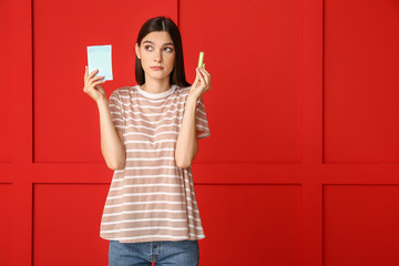 Young woman comparing menstrual pad and tampon for period protection, reproductive health and feminine hygiene choice © Pixel-Shot