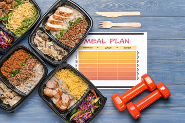 Containers with healthy food, dumbbells and meal plan on color background