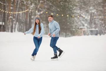 Couple man and woman at the rink.