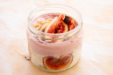 Healthy Chia pudding with yogurt, figs, oats in the jar