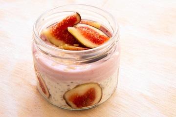 Healthy Chia pudding with yogurt, figs, oats in the jar