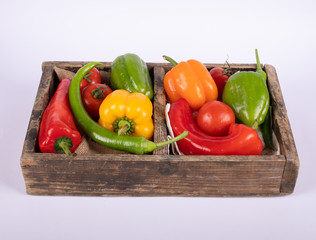 Color peppers tray in white background