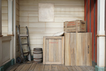 Old vintage wooden cargo boxes in the corner of the storage room