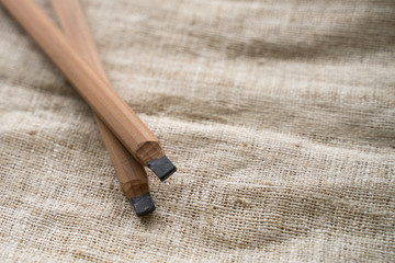 Pencil for drawing outline before sewing on sackcloth with measuring tape