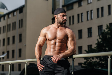 Sexy athlete sucks and poses topless. Europe.