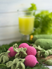 Knitted vegetables: cabbage, beets, radishes, peas, tomato. Concept. Stylization. Needlework. Environmentally friendly toys for children to develop fine motor skills. Hand made toys. 