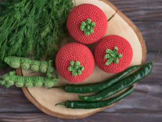 Knitted vegetables: cabbage, beets, radishes, peas, tomato. Concept. Stylization. Needlework. Environmentally friendly toys for children to develop fine motor skills. Hand made toys. 