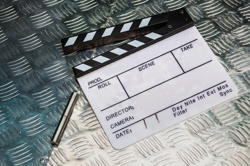 Fototapeta premium Clapperboard on metallic box surface background