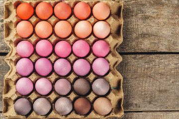 Traditional Christian eastertime, painted eggs in egg box.