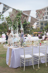 Outdoor catering dinner at the wedding with homemade garnishes decoration