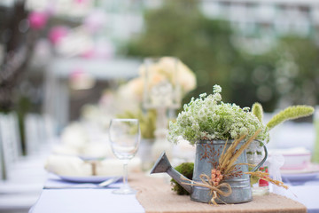 Outdoor catering dinner at the wedding with homemade garnishes decoration