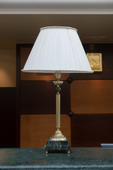Table lamp at the hotel counter