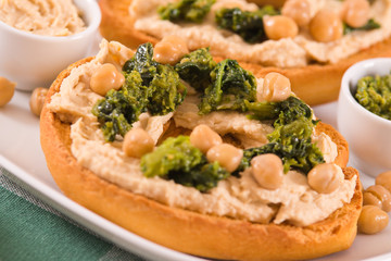 Friselle with turnip tops and hummus.