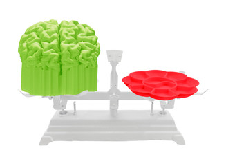 Brain and watercolor tray on white scale. Concept science vs art. Montage work on photograph...