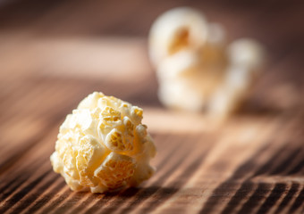 Popcorn flakes on a wooden background