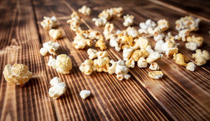 Popcorn flakes on a wooden background