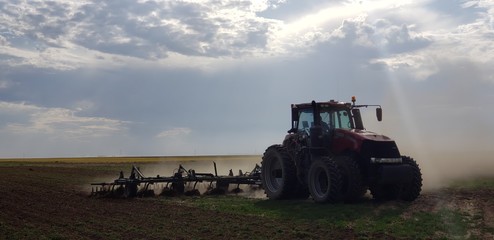tractor plowing field