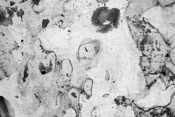 Texture of a concrete wall with cracks and scratches which can be used as a background