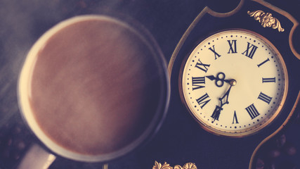 Antique clock with Roman numerals and coffee beans