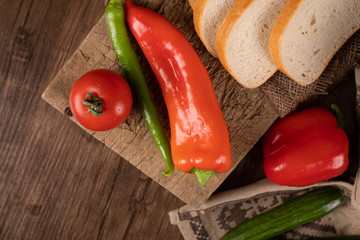 Red and green hot chilies with tomato and bread