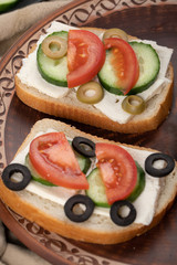 sandwiches with marinated black and green olives