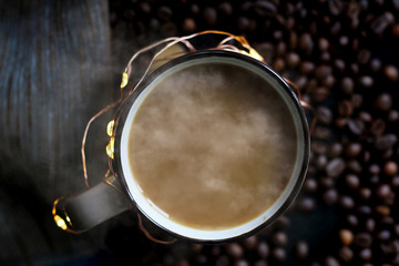 A Cup of coffee and garland, coffee bean, top view
