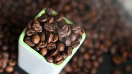 Coffee beans in a white ceramic jar