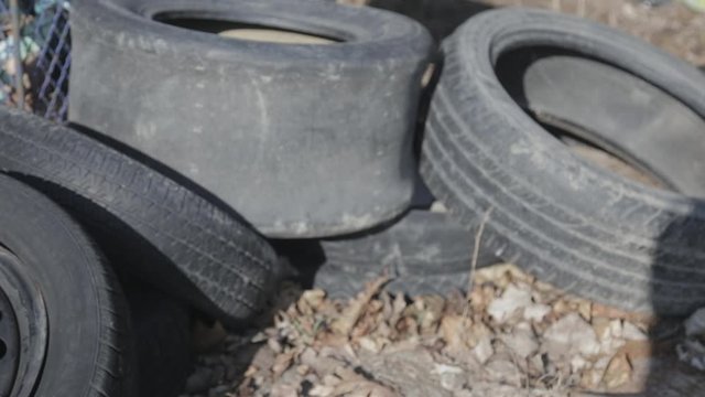 Used tire stacks in Workshop vulcanization yard - Close Up Shot