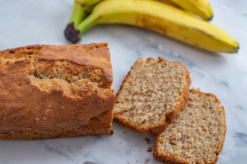 Banana Bread Loaf Sliced On Wooden Table
