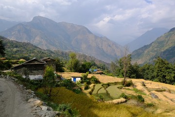 Mountain view with village and  terraced fields in Himalayas around Tatopani, Nepal. During trekking around Annapurna