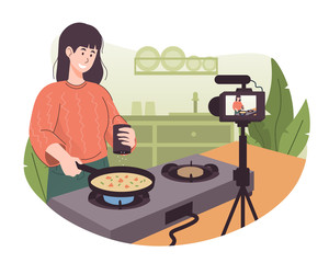 Female chef cooking in the kitchen while recording video using her camera for her online video channel. Food blogger preparing some food