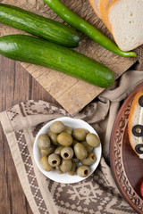 Marinated green olives and green chilies.