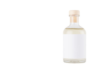 Transparent glass bottle for cosmetic, perfume, alcohol drink with  white label, cork, yellow...
