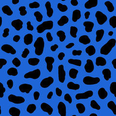 Black spots on a blue background. Animal print. Spots of a cow and dolmatins. Seamless pattern for fabric, for wallpaper, for paper, for plastic and other surfaces.