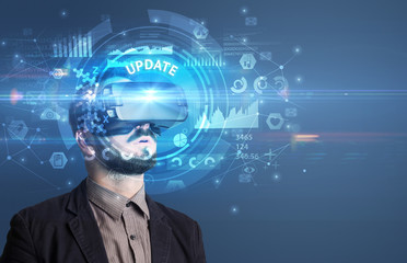 Businessman looking through Virtual Reality glasses with UPDATE inscription, innovative technology concept