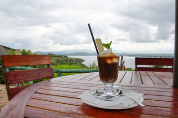 glass of iced coffee on wooden table