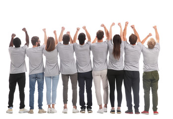 Obraz premium rear view. a group of young like-minded people holding their hands up