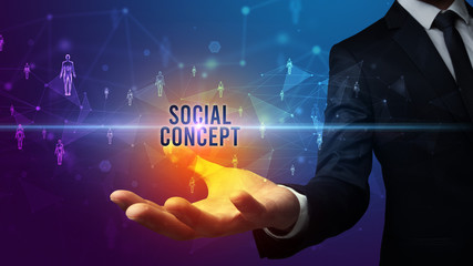 Elegant hand holding SOCIAL CONCEPT inscription, social networking concept