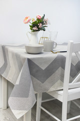  plates on the table, table with a gray tablecloth, served table