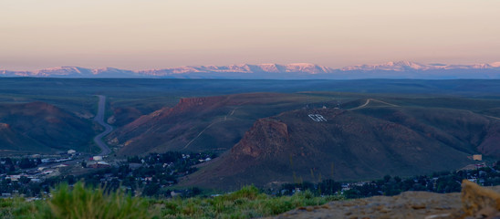 Sunrise over Green River, Wyoming. Showing the mountain monogram and Uinta Mountains in the...