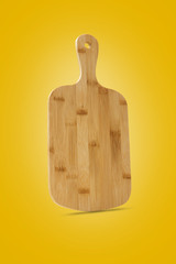 Bamboo wood cutting board, handmade wood cutting board on yellow background included clipping path.