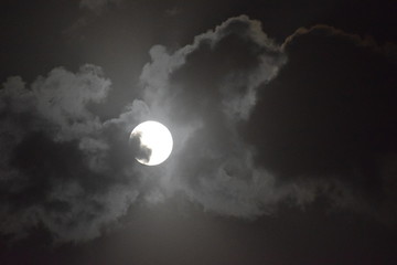 Full moon view during cloudy night in the sky