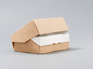 festive cardboard packaging for small gifts on a gray background
